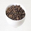 4911663-whole-black-pepper-in-white-porcelane-bowl